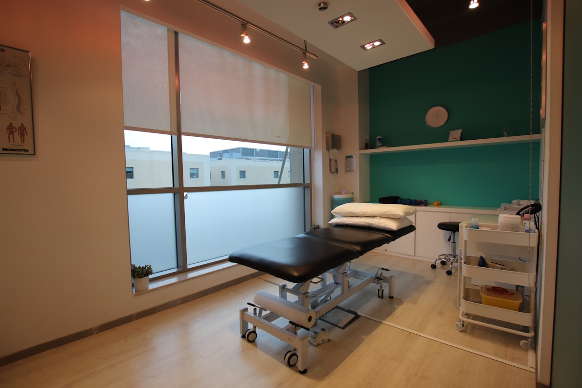 Bright, clean therapy room with treatment table
