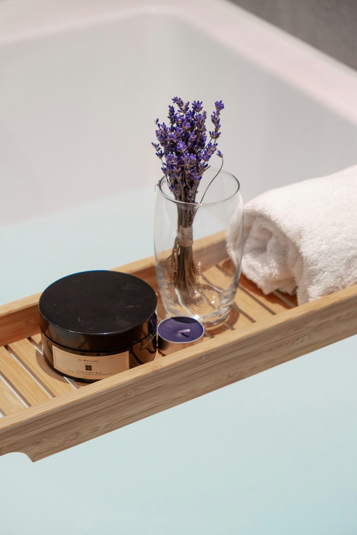 Spa tray with lavender, candle and rolled towel